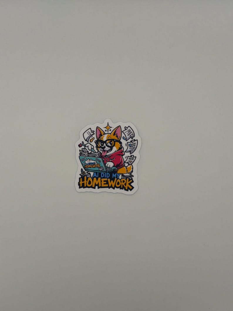 May include: A die-cut sticker featuring a cartoon corgi wearing black glasses and a red hoodie, typing on a laptop. The screen displays the text AI DID MY HOMEWORK. Floating papers surround the dog, and the text AI DID MY HOMEWORK appears in bold yellow letters at the bottom of the sticker design.