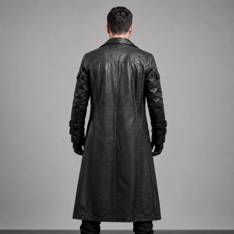 May include: A long, black leather coat with a classic design. The coat features a notched collar, multiple pockets, and a button closure. The sleeves have adjustable cuffs. The coat is worn over black gloves and pants.