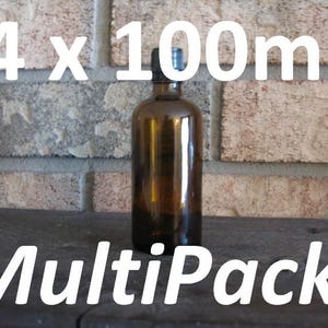May include: A brown glass bottle with a black cap, against a brick background. The text "4 x 100ml MultiPack!" is displayed in white. The bottle is likely for essential oils or similar products.