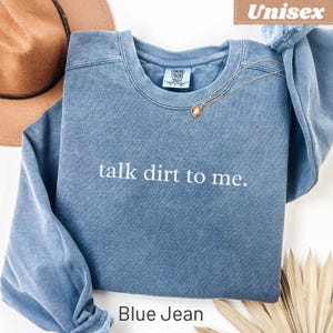 Unisex Comfort Colors sweatshirt with "talk dirt to me." text, Blue Jean color.