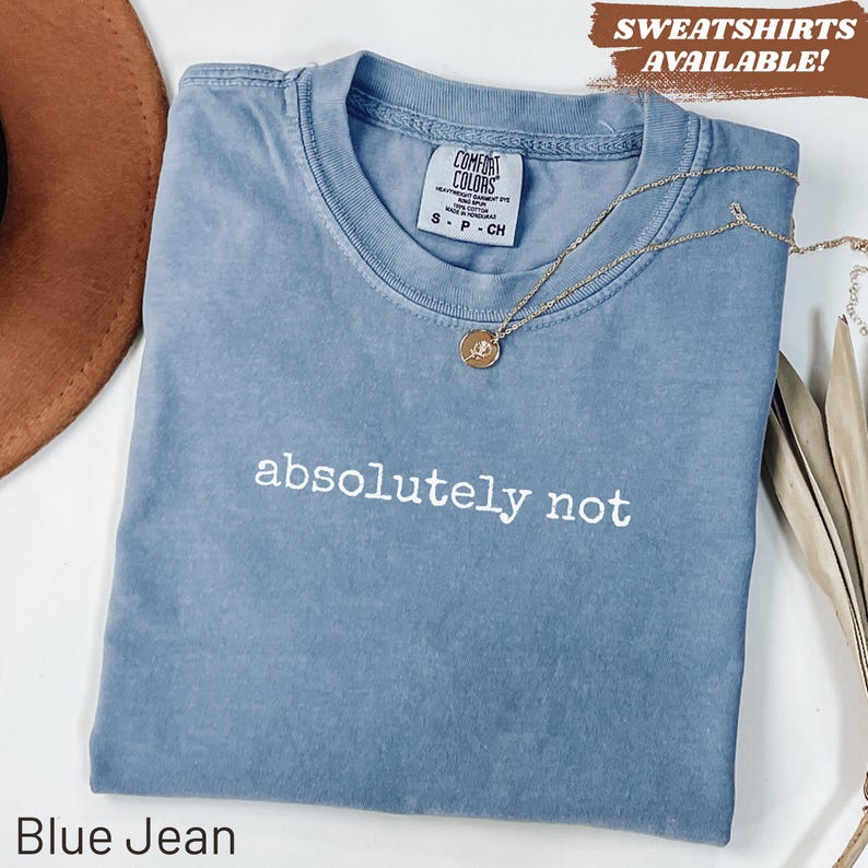 Blue crewneck t-shirt with "absolutely not" printed in white.