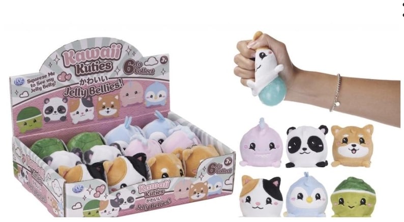 May include: A display box of Kawaii Kuties Jelly Bellies plush toys. The box features various animal designs, including a panda, a dog, and a penguin. A hand squeezes a white and blue plush toy. The text "Squeeze Me to See my Jelly Belly!" is visible.