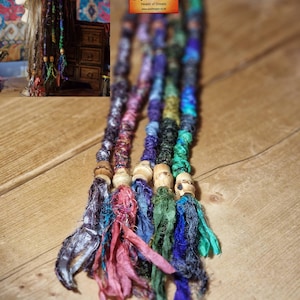 May include: A set of three ceramic mugs with a speckled, matte finish. The mugs are in shades of cream, light gray, and dark gray. Each mug has a simple, minimalist design and a rounded handle.