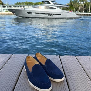 Men wearing navy suede Yacht loafers on foot, casual elegant slip-on shoes with belt