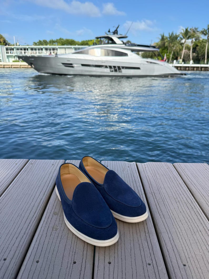 Men wearing navy suede Yacht loafers on foot, casual elegant slip-on shoes with belt