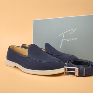 Men’s navy suede loafers with matching belt, coordinated set, luxury slip-on shoes.