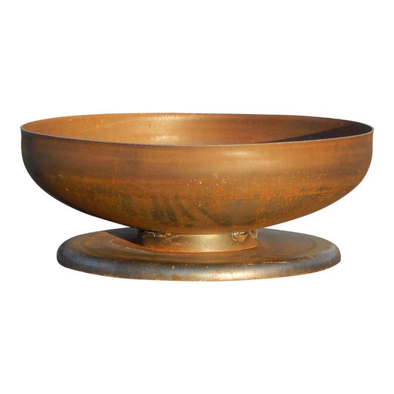May include: A circular fire pit bowl with a weathered, rusted brown metal finish. The bowl features a smooth, curved interior and exterior surface, resting securely on a flat, circular metal base that provides stability for the structure.