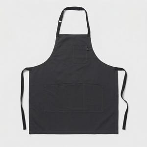 May include: A plain black apron with a large front pocket and a smaller chest pocket. It features adjustable neck straps and long waist ties. The apron is made of a durable fabric, suitable for cooking or crafting.
