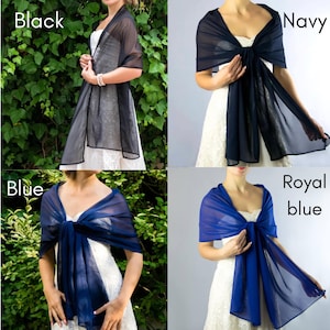 May include: Four different colors of sheer chiffon scarves. The colors are black, navy, blue, and royal blue. The scarves are draped around the shoulders of models.