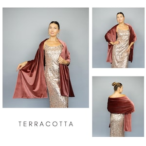 May include: A terracotta-colored velvet shawl draped over a gold sequined dress. The image shows the shawl from multiple angles, highlighting its texture and drape. The word "TERRACOTTA" is displayed in a clean, sans-serif font.