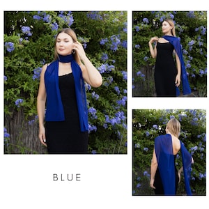 May include: A three-panel image showcasing a blue scarf and cape. The scarf is draped around the neck and shoulders. The cape drapes over the shoulders and arms. The word "BLUE" is at the bottom of the image. The background is a bush with blue flowers.