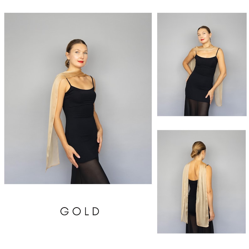 May include: A gold-colored scarf draped over a black dress. The scarf is rectangular and appears to be made of a sheer fabric. The word "GOLD" is printed in a minimalist font at the bottom of the image.