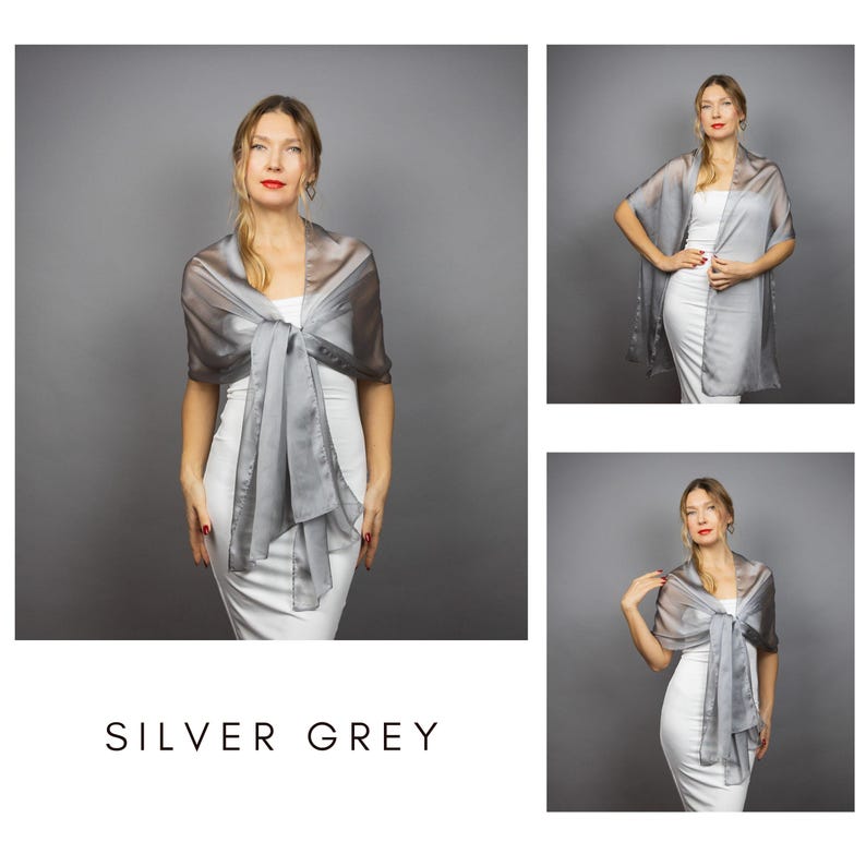 May include: A silver-grey sheer shawl worn over a white dress. The shawl is tied in a bow at the front, with long flowing panels. The text "SILVER GREY" is displayed at the bottom of the image. The image is composed of multiple views of the same item.