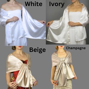 May include: Four satin shawls in different colors: white, ivory, beige, and champagne. The shawls are draped over the shoulders of four models.