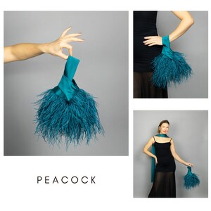 May include: Teal clutch bag with a handle and a fluffy feather trim. The word "PEACOCK" is printed in black at the bottom of the image. The bag is shown in multiple images, including one held by a person.