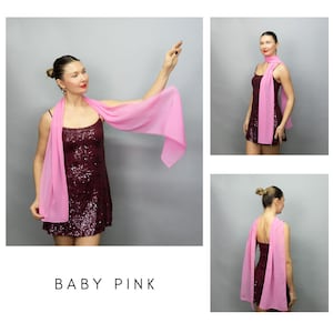May include: A baby pink scarf draped over a sequined burgundy dress. The scarf is lightweight and flowing, with a soft, delicate appearance. The image includes the text "BABY PINK".