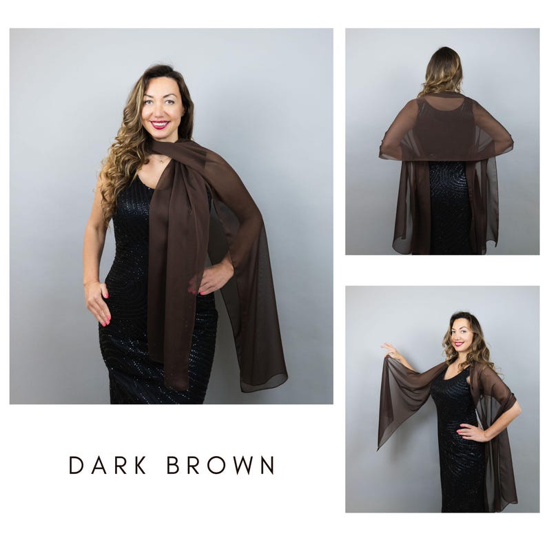 May include: A dark brown sheer shawl draped over a black dress. The shawl is long and flowing, with a rectangular shape. The text "DARK BROWN" is displayed at the bottom of the image.