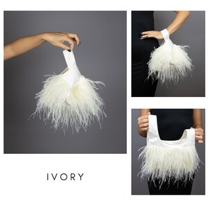 May include: Ivory clutch bag with a satin handle and a fluffy feather trim. The bag is shown in multiple views, held by a person against a grey background. The word "IVORY" is displayed below the bag.