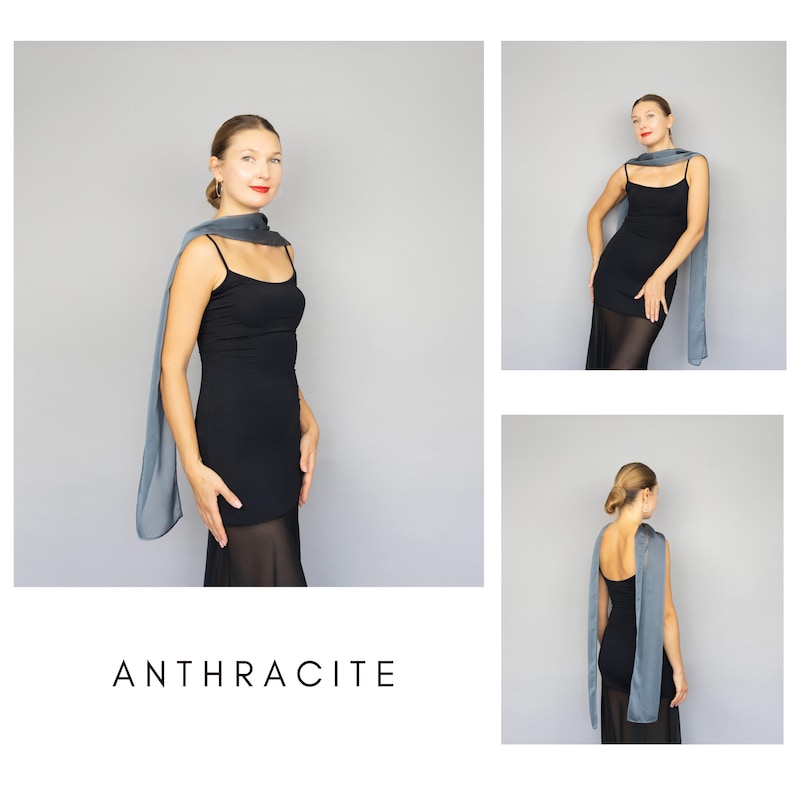 May include: A woman wearing a black dress and a gray scarf. The word "ANTHRACITE" is displayed in white text at the bottom of the image. The scarf is draped over the shoulders and arms.