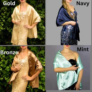 May include: Four women wearing different colored satin shawls. The shawls are in gold, navy, bronze, and mint. The women are wearing different dresses and are standing in front of a green leafy background.