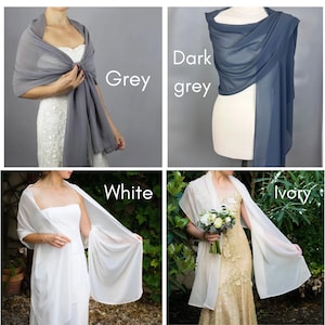 May include: Four different color variations of a sheer chiffon shawl. The colors are grey, dark grey, white, and ivory. The shawls are draped over mannequins wearing wedding dresses.