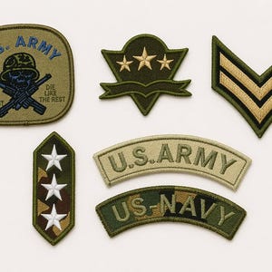 May include: A collection of embroidered military patches, including U.S. Army and U.S. Navy insignia. The patches feature various designs, such as chevrons, stars, and text. One patch has a skull with crossed rifles and the text "MESS WITH THE BEST DIE LIKE THE REST."