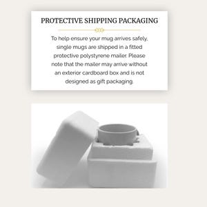 May include: A white ceramic mug nestled inside a two-piece fitted white polystyrene protective mailer. The text above reads: PROTECTIVE SHIPPING PACKAGING. To help ensure your mug arrives safely, single mugs are shipped in a fitted protective polystyrene mailer.