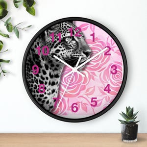 May include: A set of three ceramic mugs with a speckled, matte finish. The mugs are in shades of cream, light gray, and dark gray. Each mug has a simple, minimalist design and a rounded handle. The mugs are likely for coffee or tea.