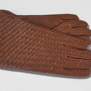 woven leather gloves with intrecciato texture, genuine sheepskin lining and smooth palm.