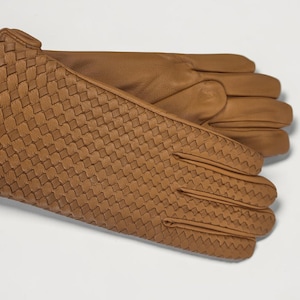 woven leather gloves with intrecciato texture, genuine sheepskin lining and smooth palm.