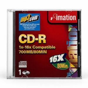 Op de afbeelding: Een doorzichtig plastic doosje met een Imation CD-R schijf. De inlay is donkerrood met gele tekst die CD-R, 1x-16x Compatible en 700MB/80MIN aangeeft. Het bevat het mp3.com-logo, de merknaam Imation en een 16X 80Min-afbeelding.