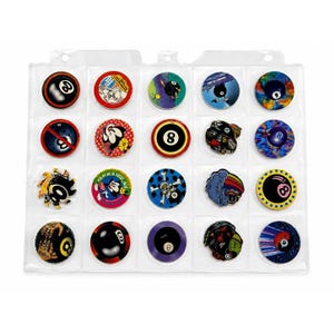 May include: A collection of twenty circular pogs arranged in a clear plastic storage sheet. The pogs feature various graphic designs including eight-ball motifs, cartoon characters, skulls, and colorful patterns in red, blue, yellow, and black.