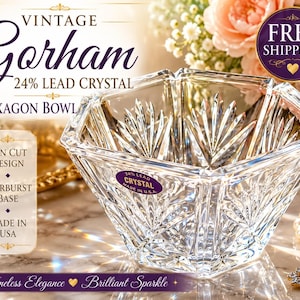 May include: Vintage Gorham 24% lead crystal hexagon bowl. The clear glass bowl features a fan cut design and starburst base. The bowl is made in the USA. The image also includes text that says "Timeless Elegance Brilliant Sparkle."