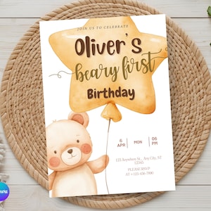 Può includere: Un invito di compleanno con un'illustrazione di un orsacchiotto che tiene in mano un palloncino a forma di stella. Il testo recita "Oliver's beary first Birthday" con i dettagli dell'evento. Il design è su sfondo bianco.