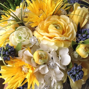 Beautiful Bridal bouquet of mix shades of Yellow and Blue flowers with a Royal Bling Handle