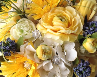 Beautiful Bridal bouquet of mix shades of Yellow and Blue flowers with a Royal Bling Handle