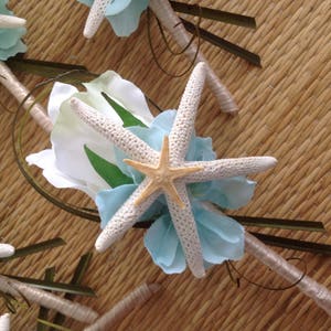 May include: A wedding bouquet with blue and white flowers and a starfish accent.