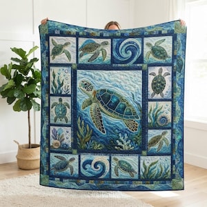 May include: A rectangular quilt featuring a large central sea turtle swimming among coral and seaweed, surrounded by a border of smaller panels depicting individual sea turtles, swirling ocean waves, and various aquatic plants in shades of blue.