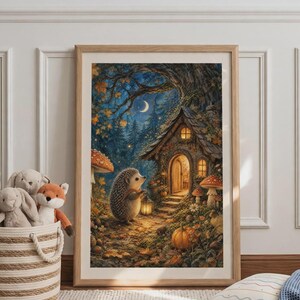 May include: A framed wall art print depicting a whimsical forest scene at night with a hedgehog holding a lantern in front of a small cottage. The illustration features autumn leaves, large mushrooms, a pumpkin, and a crescent moon in the sky.