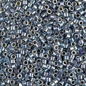 May include: A close-up view of a large quantity of small, round, silver-colored beads. The beads have a slightly iridescent finish, giving them a subtle shimmer.