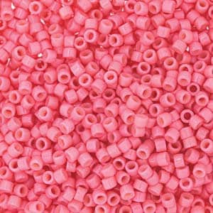May include: A large quantity of small, pink, round seed beads. The beads are opaque and have a smooth, glossy finish.