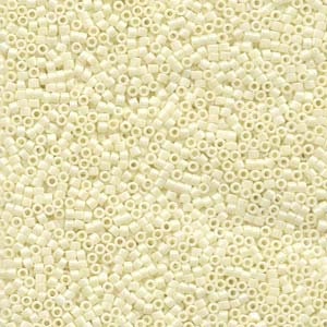 May include: A close-up view of a large quantity of small, white, opaque, round and square seed beads.