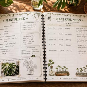 An open spiral-bound notebook showing a "Plant Profile" page with plant details and a "Plant Care Notes" page with a pen, surrounded by plants.