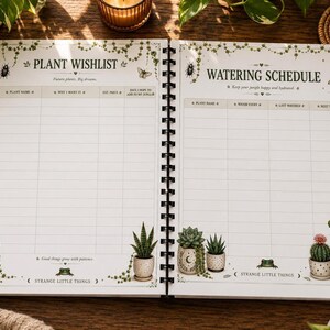 An open spiral-bound notebook showing pages titled "Plant Wishlist" and "Watering Schedule" with columns for plant details, on a wooden table with plants.