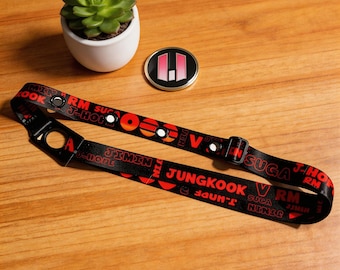 Anillo de goma ARIRANG (4 agujeros) con cuerda para el dolor, diseño con nombre de miembro en negro y rojo, impresión del nombre del miembro del grupo coreano, mercancía de apoyo para conciertos.