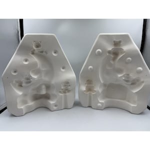 May include: A set of three ceramic mugs with a speckled, matte finish. Each mug features a different color: light blue, cream, and gray. The mugs have a simple, modern design and a comfortable handle.