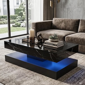 May include: A modern black coffee table with a marble-like top and a lower section that emits blue light. The table is rectangular and sits on a light-colored rug, with a brown sofa in the background.