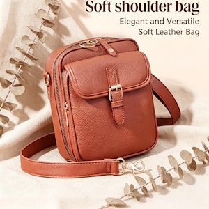 May include: A rust-colored shoulder bag with a textured surface, featuring a front flap with a buckle closure, a top zipper, and a detachable shoulder strap. The text "Soft shoulder bag" and "Elegant and Versatile Soft Leather Bag" is visible.