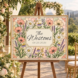 May include: A rectangular wedding sign featuring a stained glass style design with pink poppies, white daisies, and purple lavender surrounding a central cream-colored panel. The text reads The Westons and the date 08.25.2026 in black script.