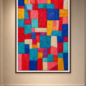 May include: A rectangular wall hanging featuring a patchwork design of various silk-like fabric squares and rectangles in vibrant shades of red, blue, yellow, pink, turquoise, orange, and cream, all framed within a dark brown border.